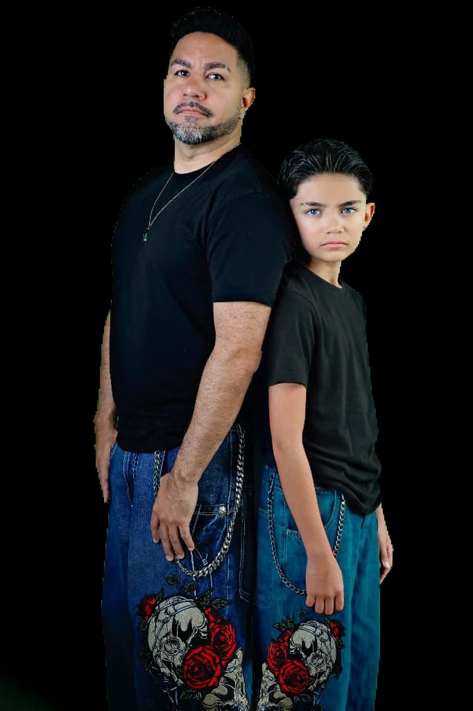 SuperZydan and his son LinkNova standing back to back in matching black tees