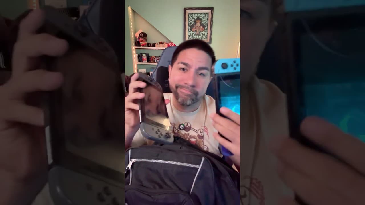 SuperZydan holding up two Nintendo Switch consoles over a backpack full of games