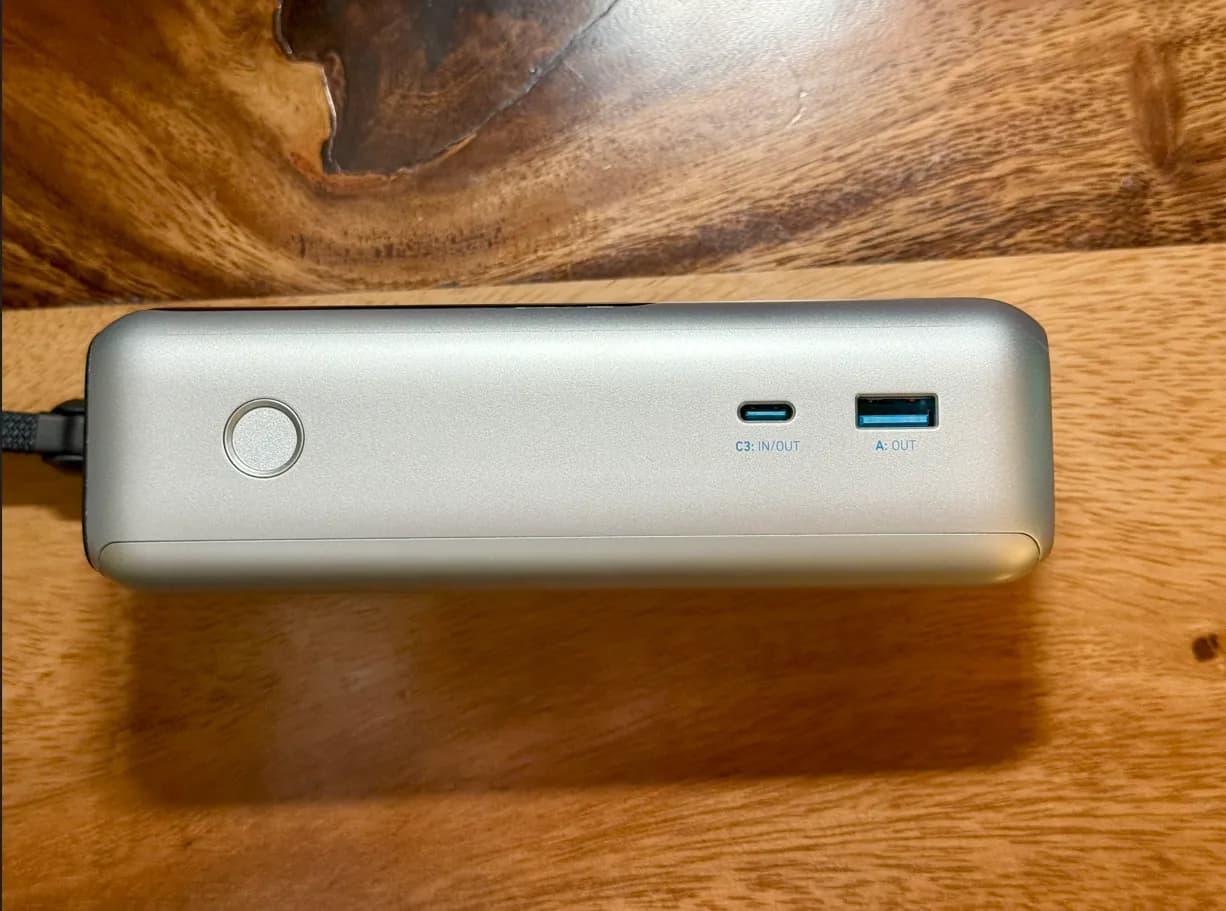 The USB-C and USB-A ports and power button on the Anker power bank