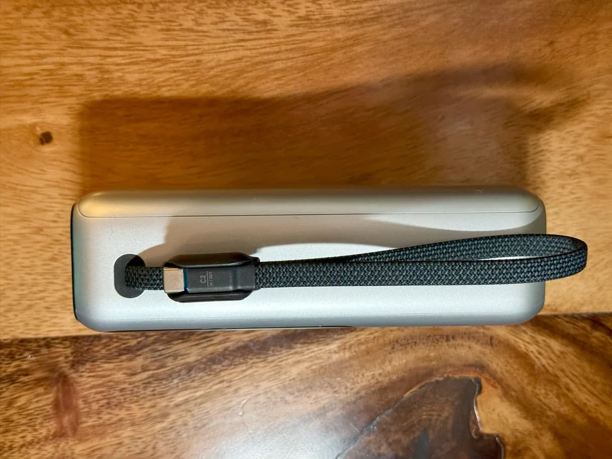 The built-in cable running along the side of the Anker power bank